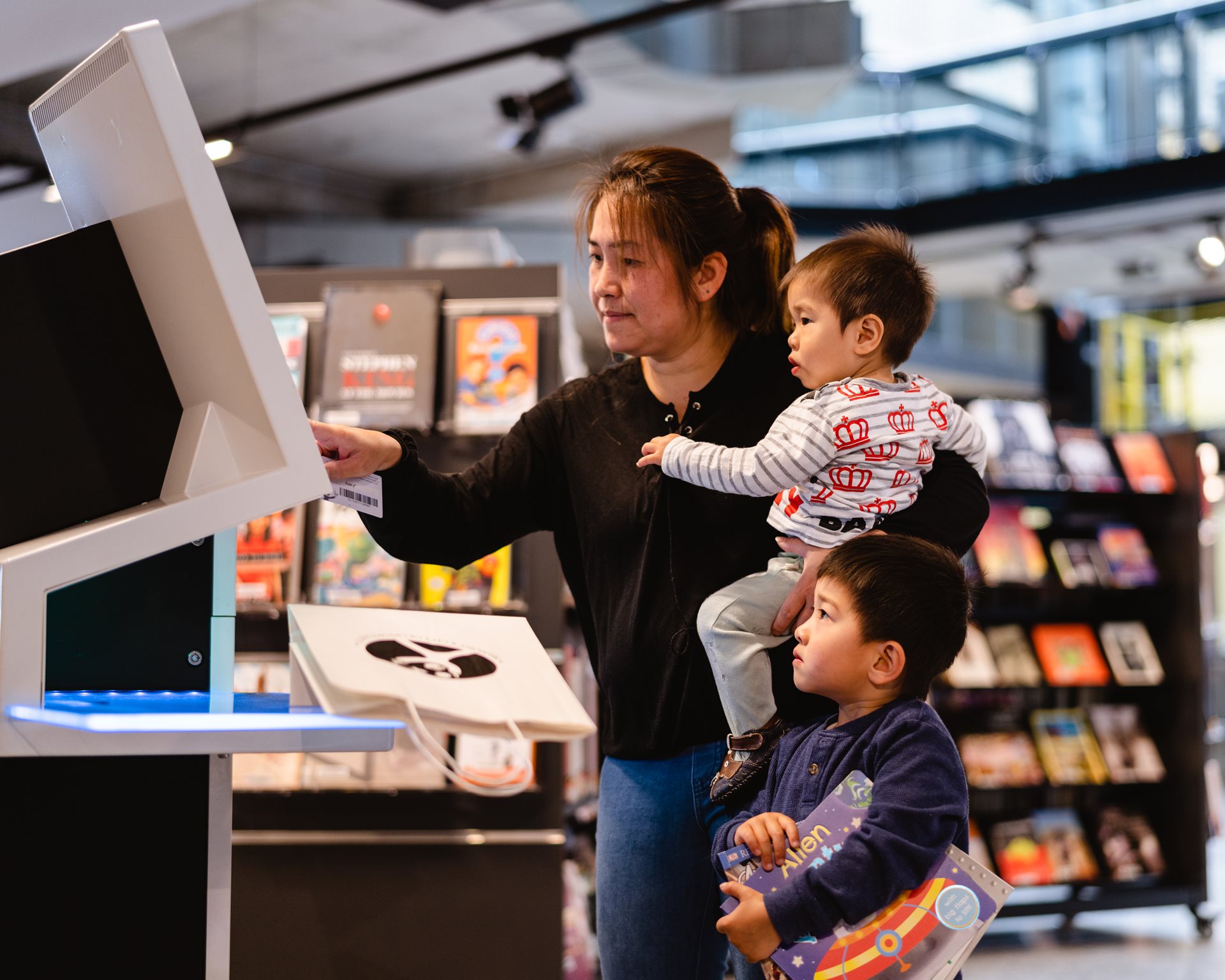 Family using library kiosk