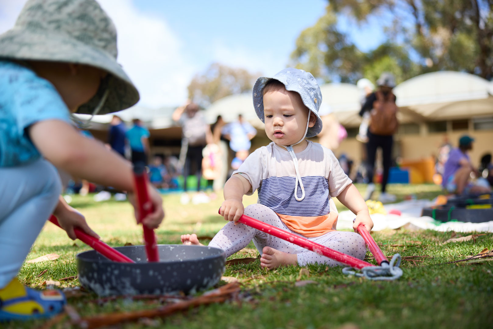 Child crawling on foam toys at event