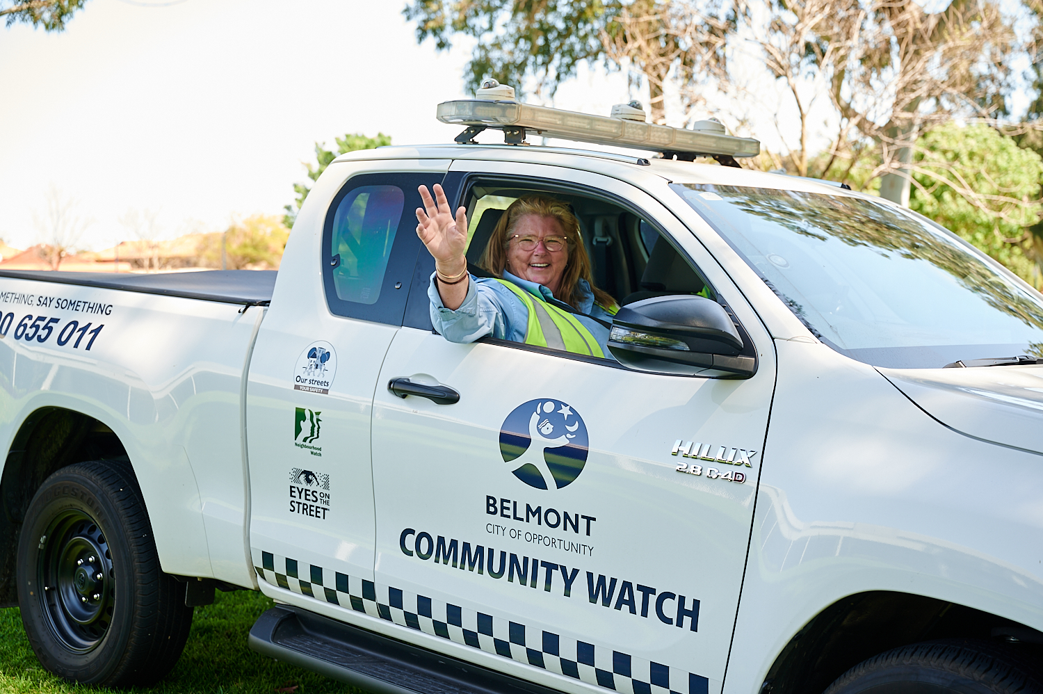 Man locking his car in the carpark.