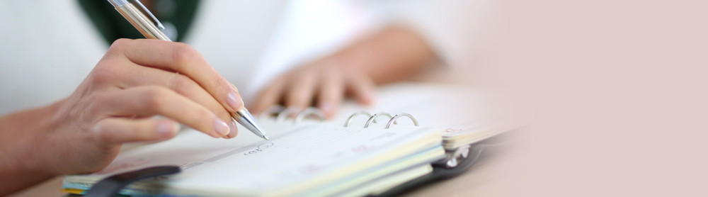 Woman writing in a book