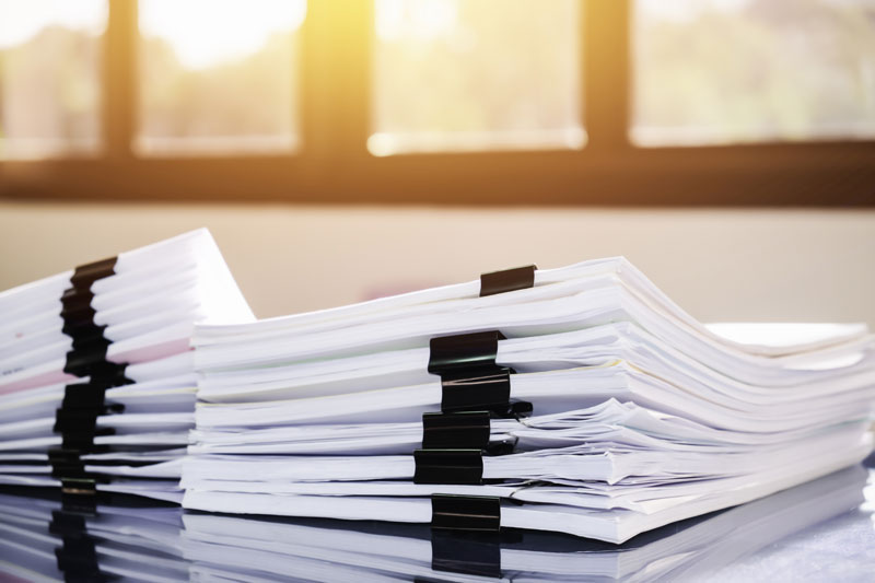 Stacks of Papers in bulldog clips