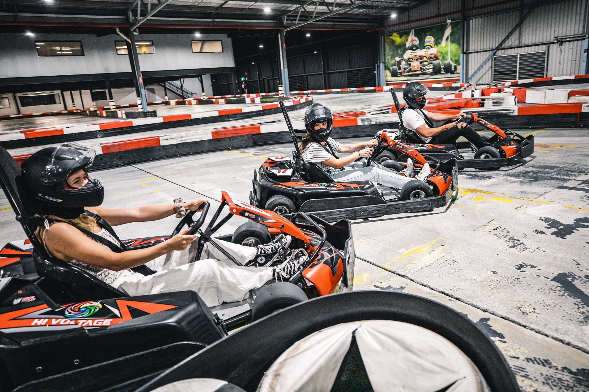 Three people go-karting