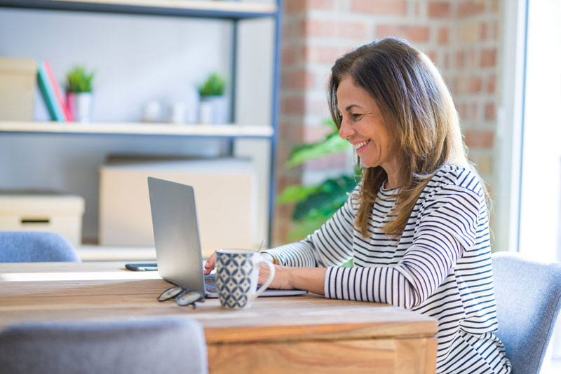 Woman working on laptop from home