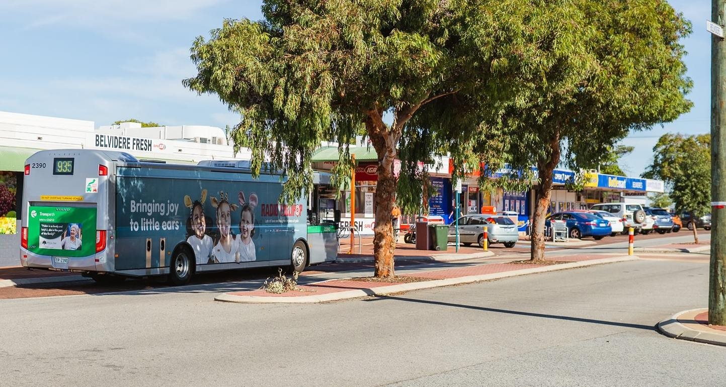 Bus travelling through Belvidere Street shops.