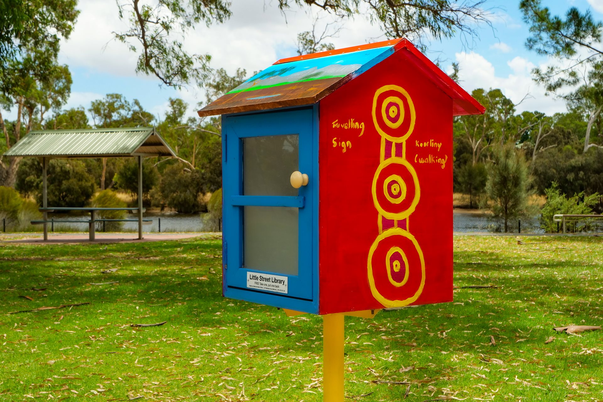 Red and blue little street library at Garvey Park