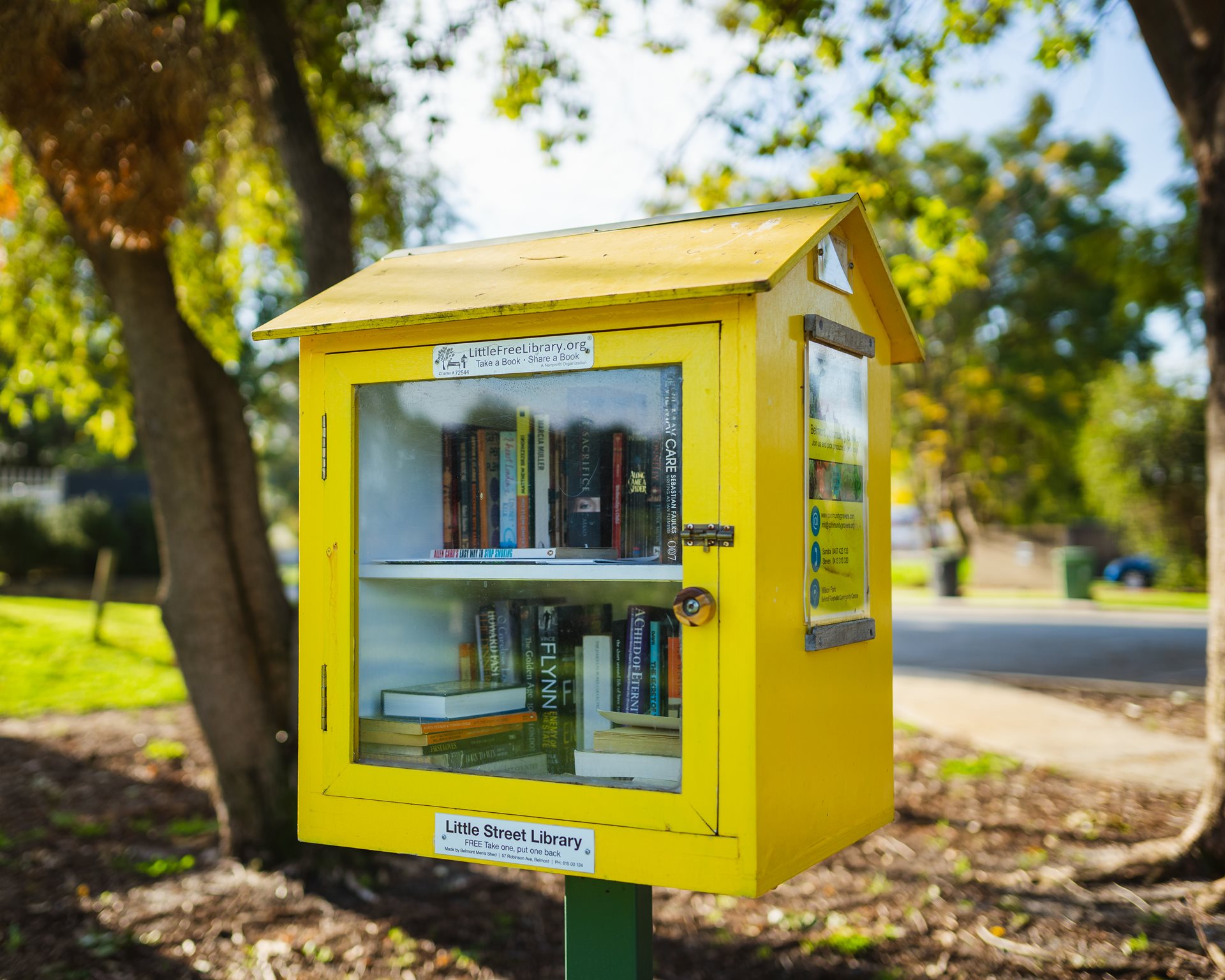 Yellow little street library at Wilson Park