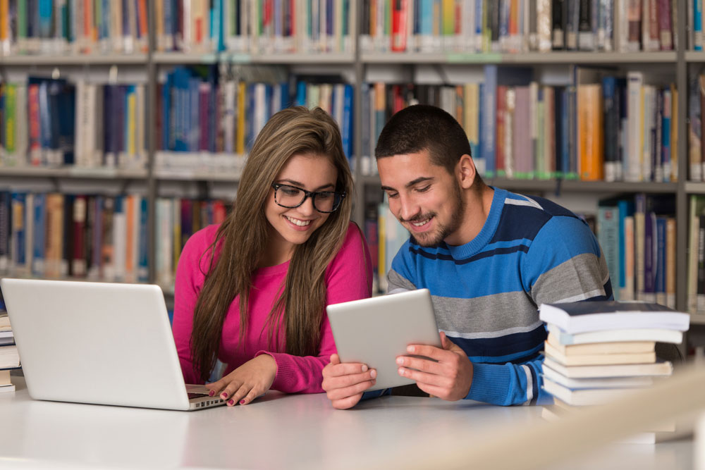 People using wi-fi in the library