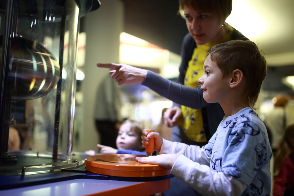 Child and parent looking at exhibit