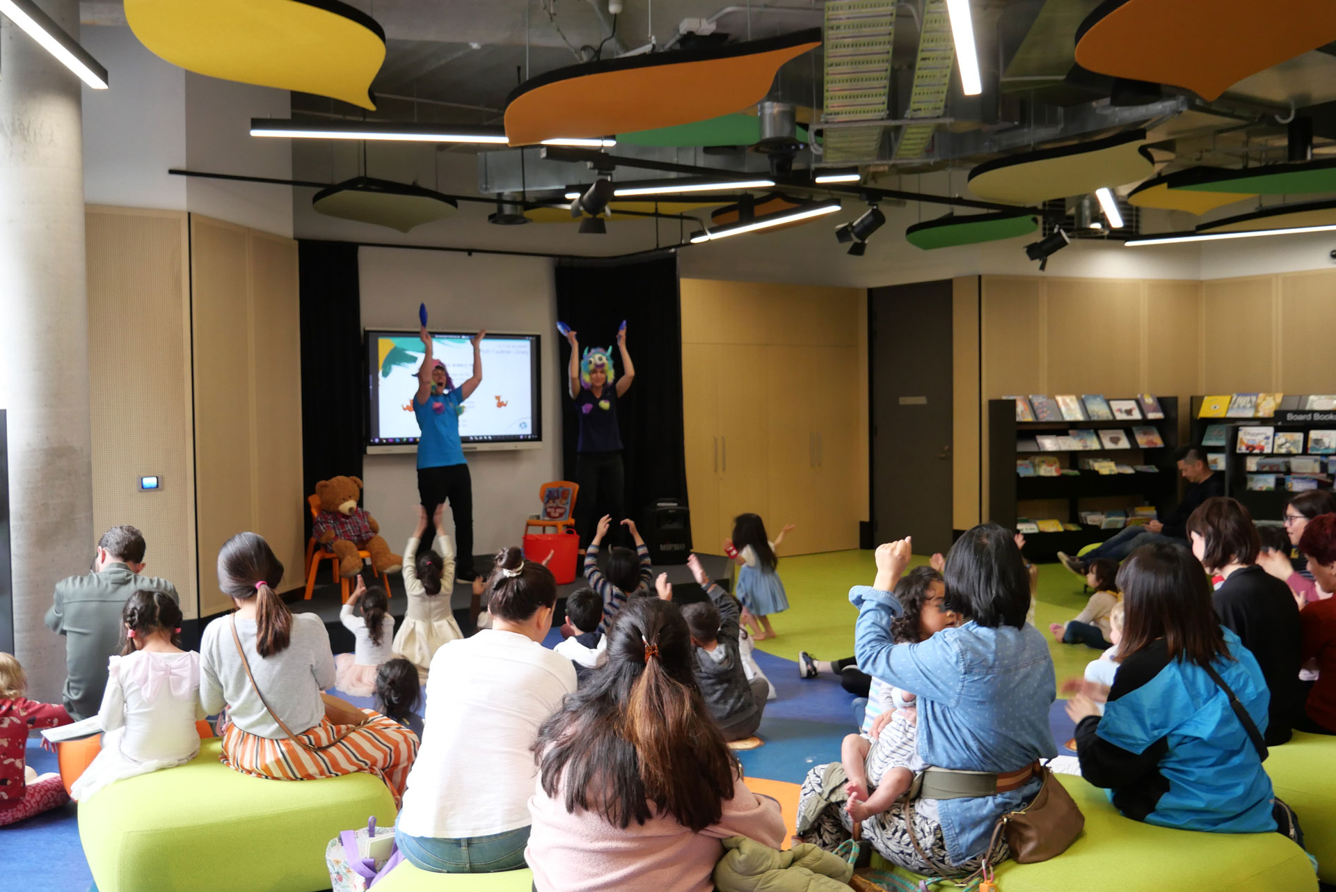 Children having fun at story time at the library. 