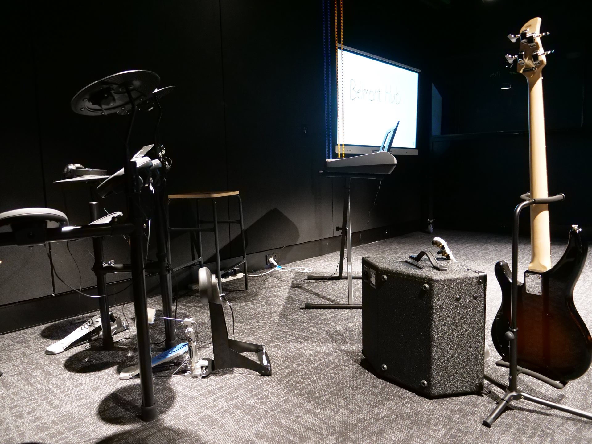 Soundproof booth looking towards recording section of the studio.