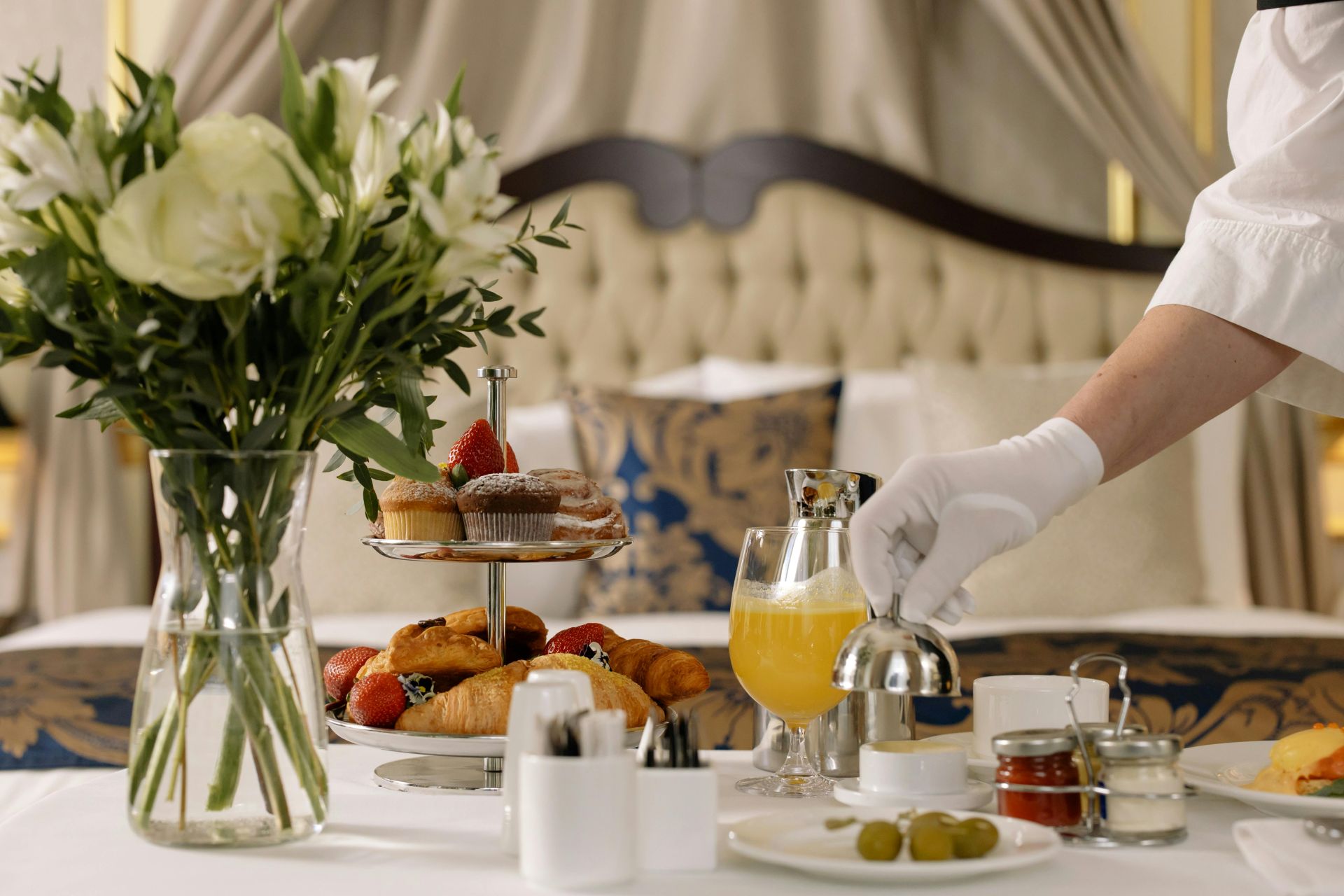 Someone serving breakfast in a hotel room