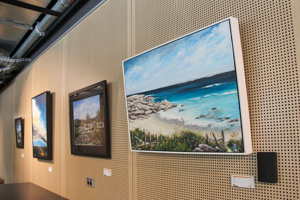Painting of a beach on the wall in the Artist's Place