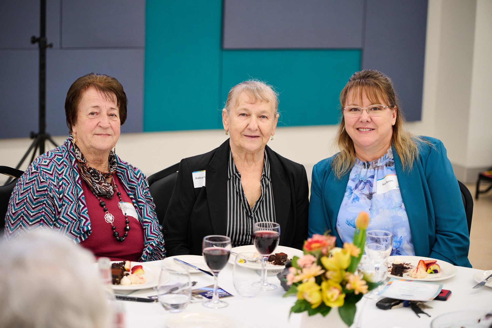 Three older women sitting together.