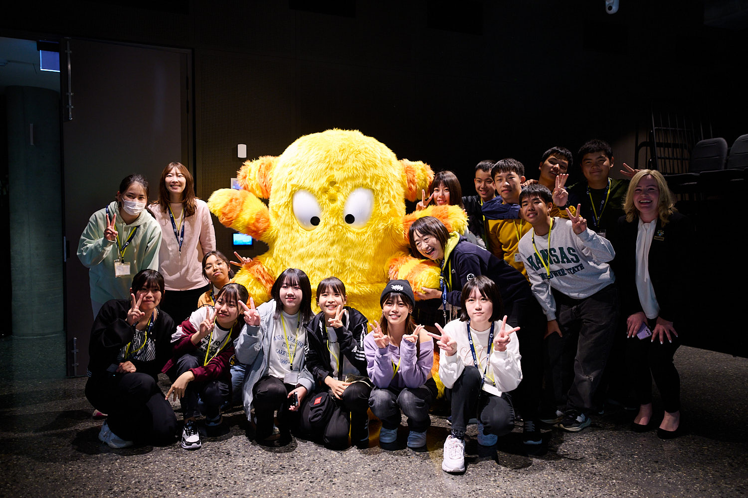Adachi participants at Ruth Faulkner Library with a Belmonster
