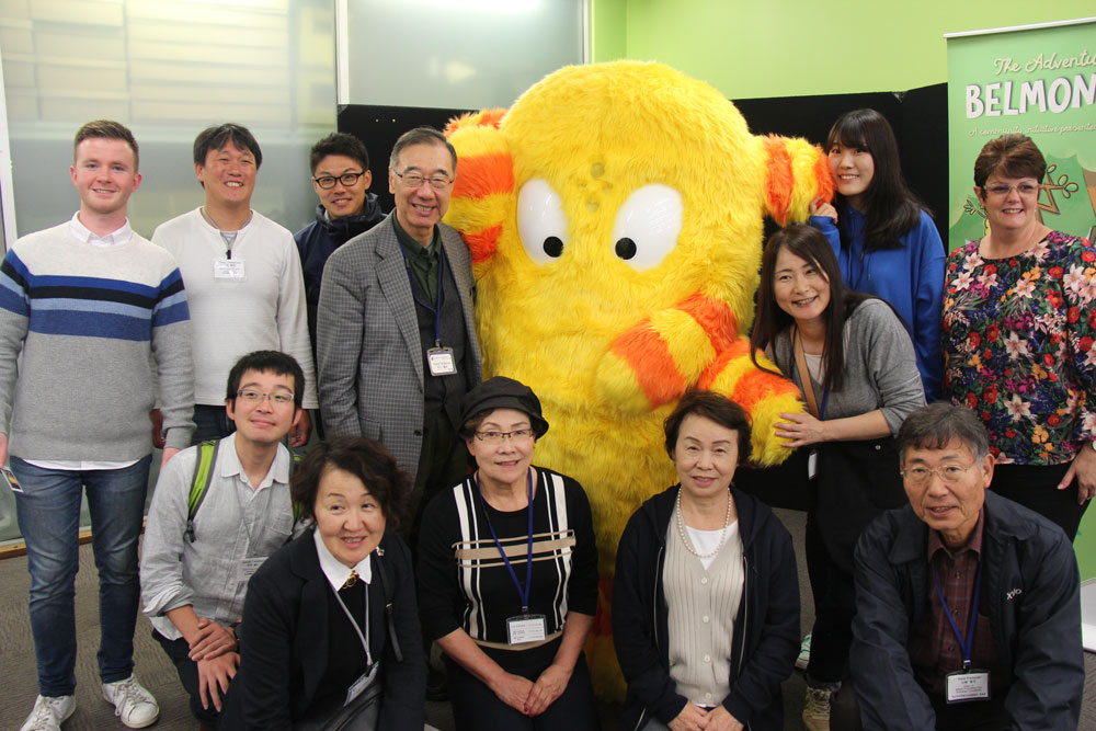 Adachi participants at Ruth Faulkner Library with a Belmonster