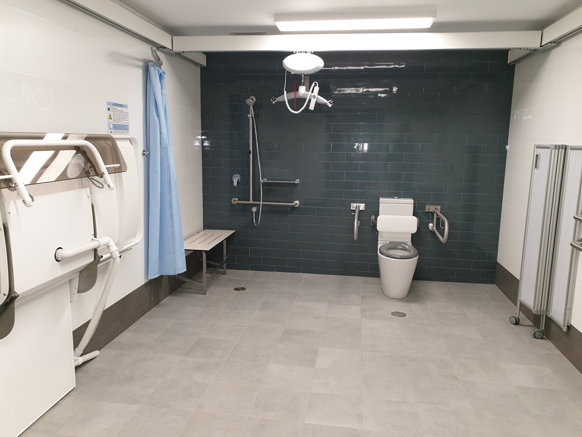 Belmont Oasis Leisure Centre Changing Places amenitites including toilet, change table, screen, hoist, shower and bench.