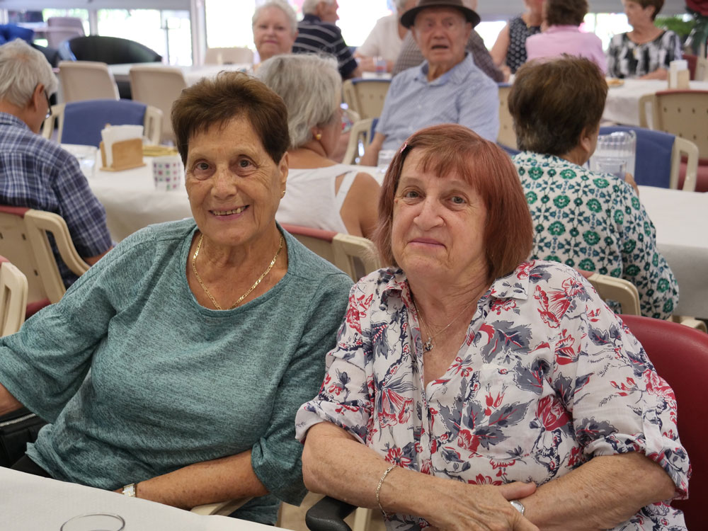 Seniors sitting down at Harman Park Community Centre.