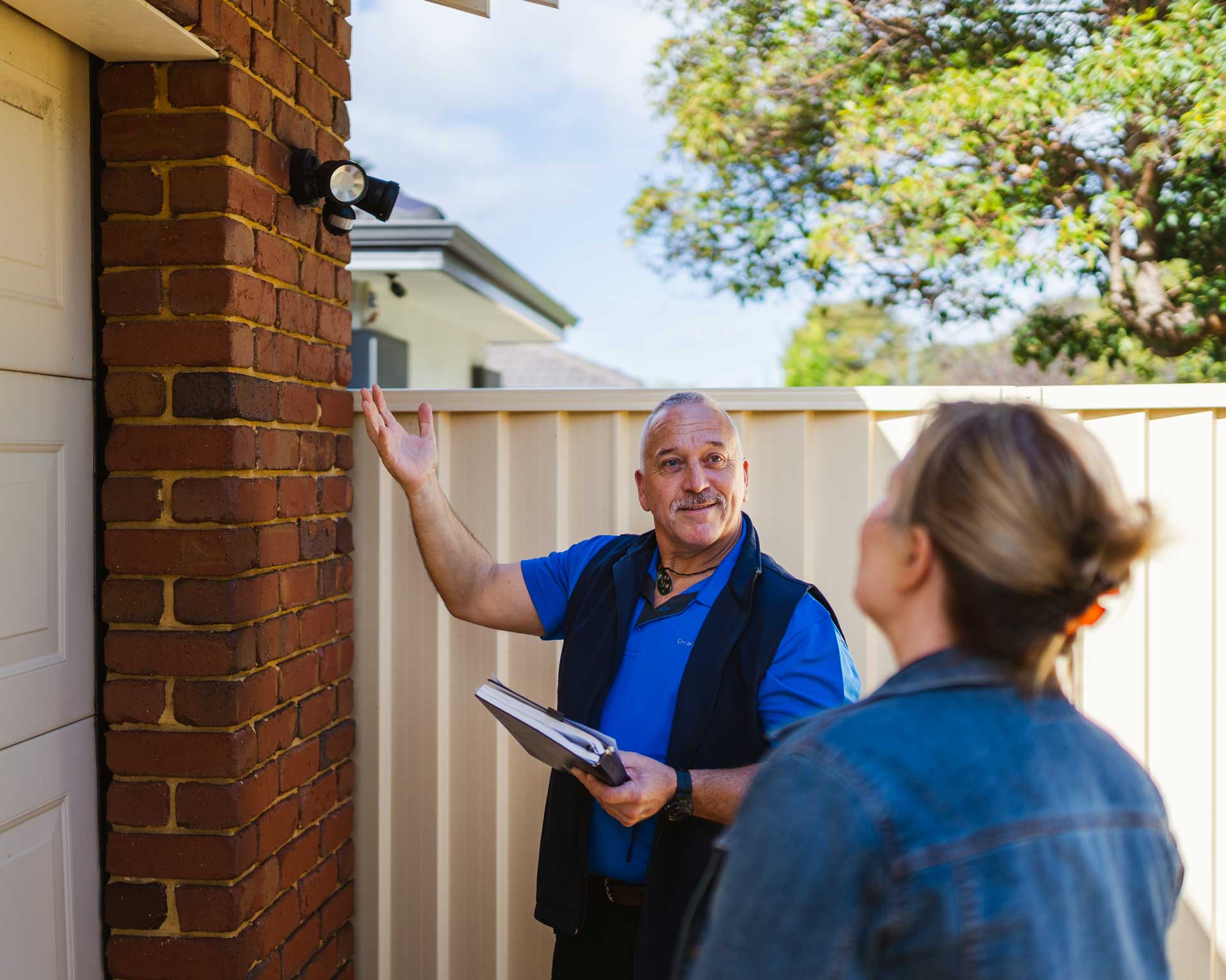 A City of Belmont team member conducting a security appraisal for a woman.