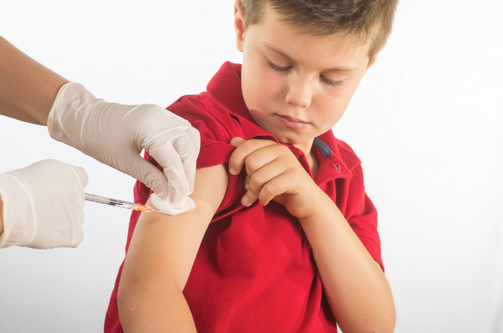 Boy being immunised
